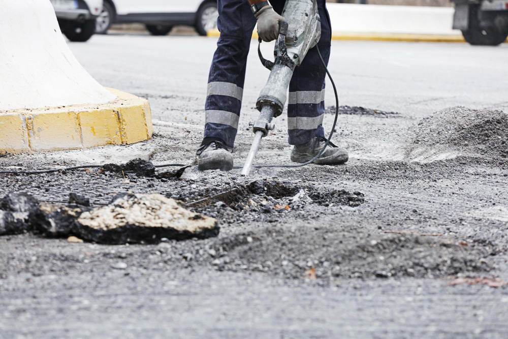 Understanding the Costs of Asphalt Removal and Sealcoating