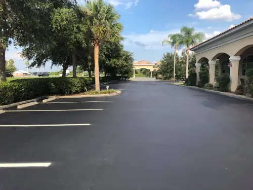 Commercial parking lot after applying sealcoat and striping