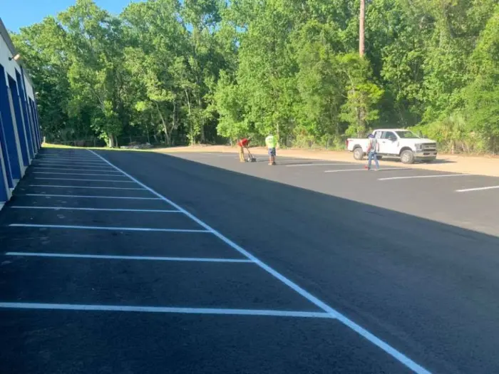 A. Rafferty team working on a parking lot striping repair